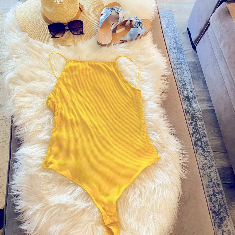 H&M women Yellow one piece top. Thong back. Body suit.(not a bathing suit)